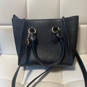 It can be a shoulder or carried bag